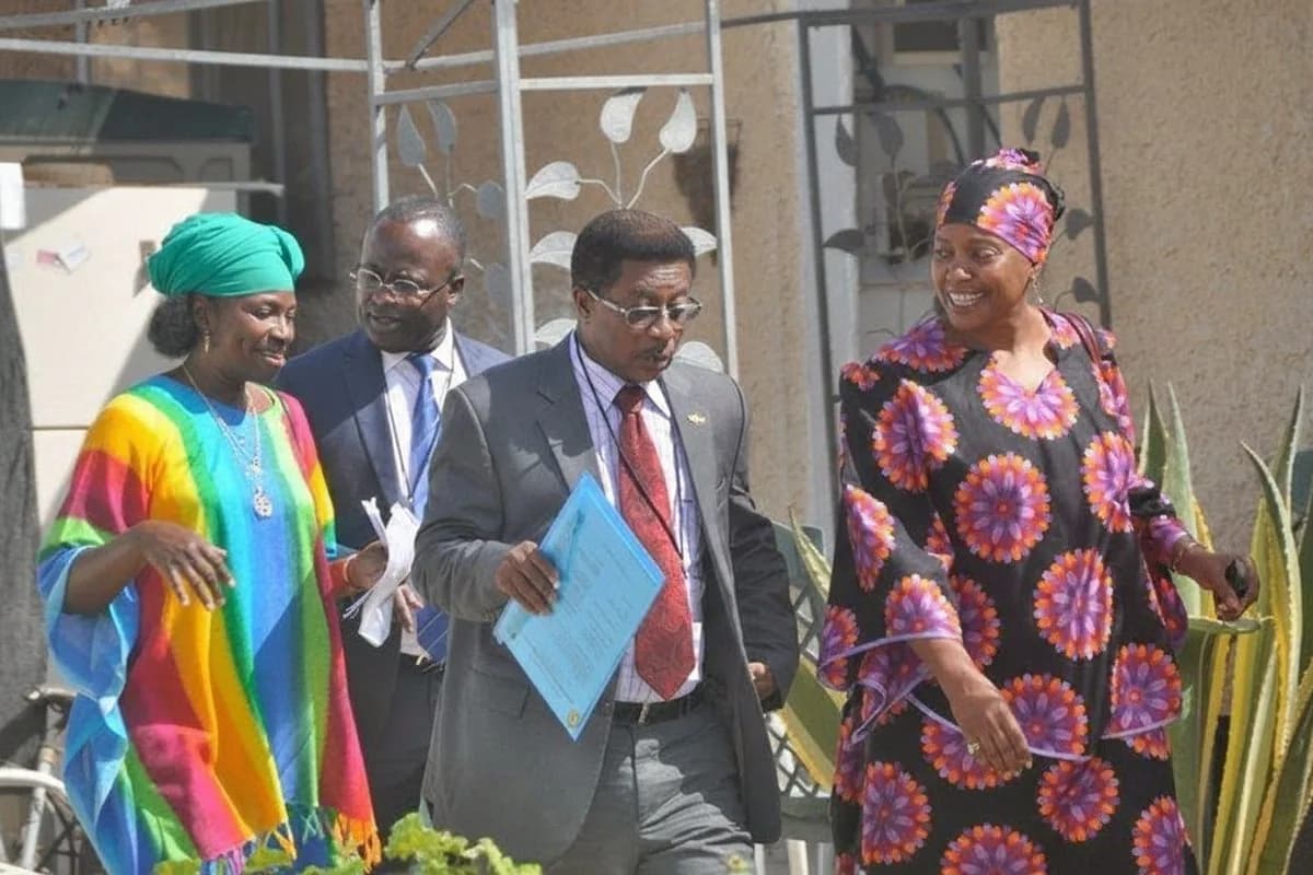 Visitors walking through the Village of Peace