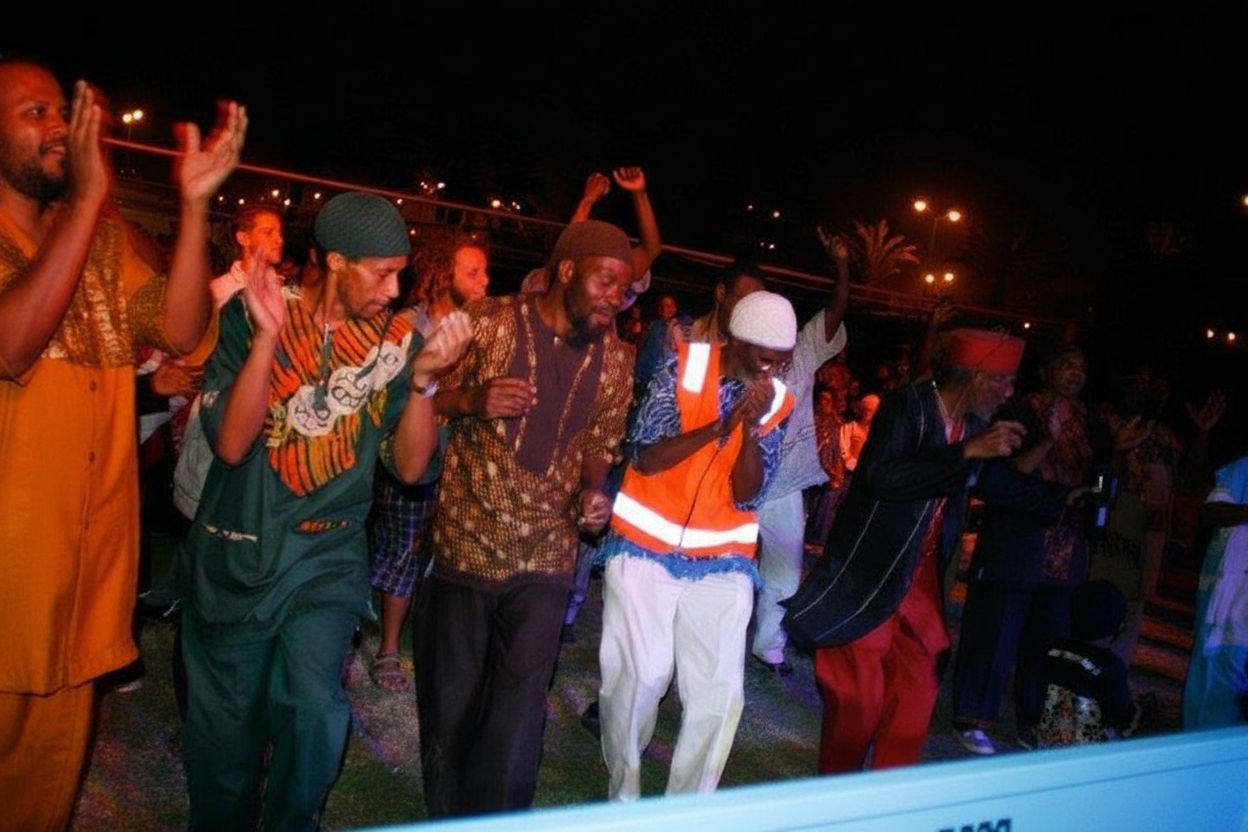 Men dancing at a night celebration in traditional African-inspired outfits