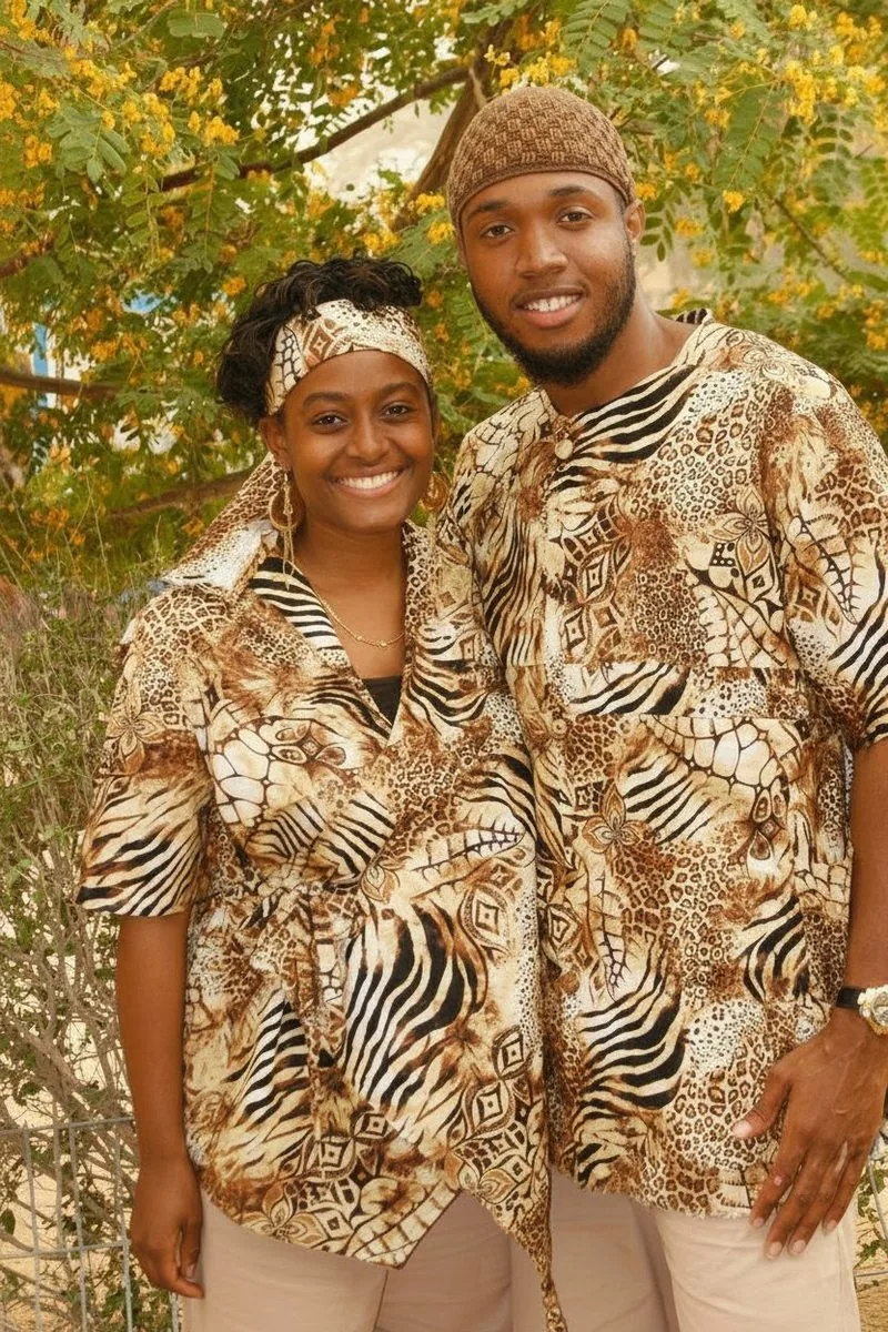 Young couple in coordinated animal-print outfits at a celebration